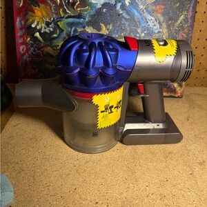 Dyson Cordless Vacuum in Blue and Yellow FOR PARTS ONLY NO CHARGER NEEDS BATTERY
